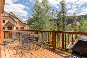 Private deck with a grill and outdoor seating.