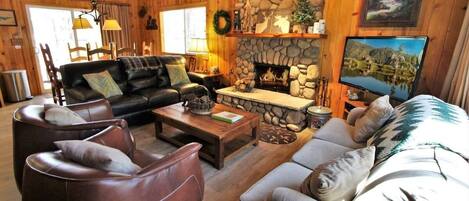 Comfortable Living Room with Stone Fireplace