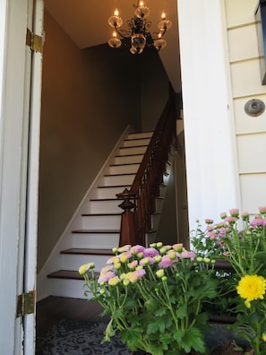 Walk into the foyer with a beautiful, original staircase.