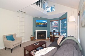Vaulted ceilings in comfortable living room. 50 inch TV and new furnishings