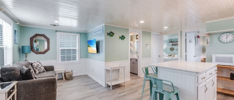 Living Area - The kitchen, dining, and living areas blend seamlessly for a bright and airy feel