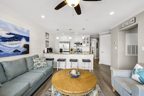 Open den and kitchen with ample seating.
