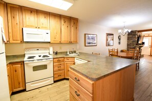Kitchen - Fully equipped kitchen and dining area.