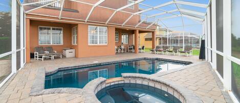 View of back of home from pool deck