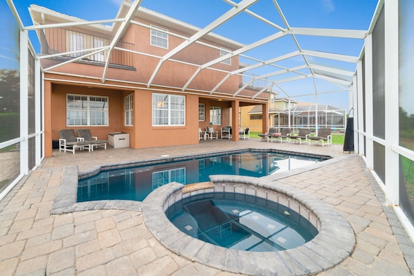 View of back of home from pool deck