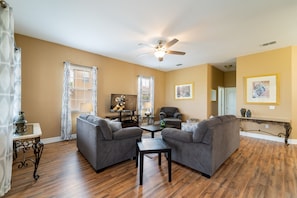 Living room showing seating  arrangement and TV