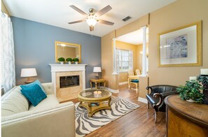 Family room showing faux fireplace and seating arrangement