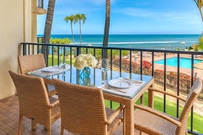 Unwind on this breezy lanai where island skies, swaying palms, and sunny moments frame every peaceful pause KS-258