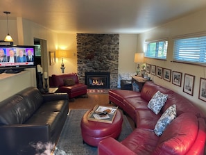 The brown sofa is a queen sofa bed, the gas fireplace has a thermostat.
