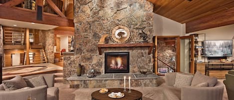Great room with fireplace and plenty of plush seating
