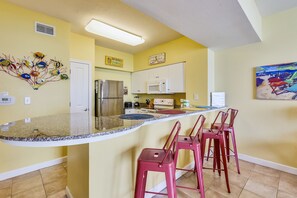 Bar Seating and Fully Stocked Kitchen