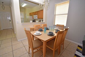 Dining table seating 6 and kitchen bar seating for 2