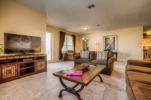 Discover the lofty living area of our Orlando, Florida apartment, where sophistication meets comfort and functionality. Equipped with a Smart TV for endless entertainment via Netflix.