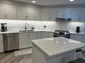 Separate island in completely remodeled kitchen