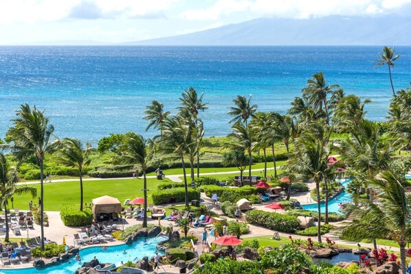 Soak in panoramic ocean views, swaying palms, and lagoon-style pools?pure paradise from your Maui lanai HKH-746