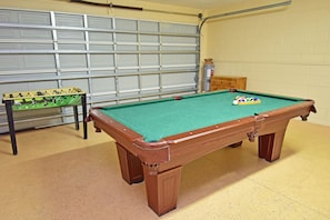 Game room with pool table and foosball