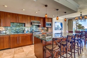 Gourmet kitchen and oceanview dining blend elegance, function, and island charm for unforgettable meals at home.! HKH-201