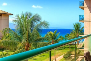 Step onto your lanai and soak in panoramic views of lush palms, golden sand, and endless blue ocean HKH-412