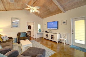 Indoor - Living area with ceiling fan and TV