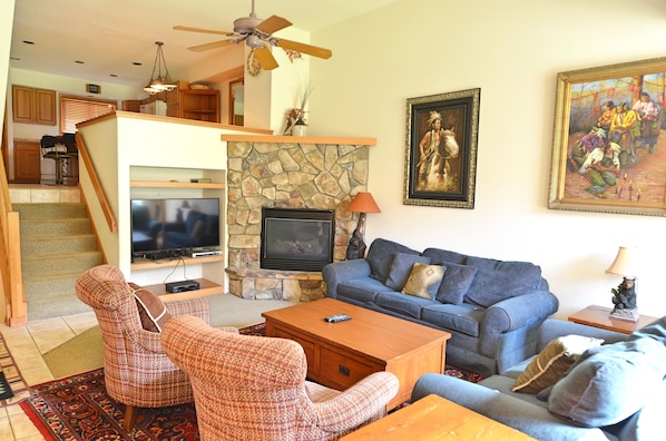 Living Room Area - The cozy living room is large enough for the entire party to get together! It has a fireplace, a sofa sleeper, and a TV.