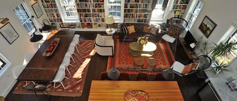 View of the book-bedecked living room from the balcony.