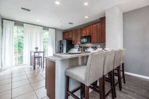 Culinary Haven: Embrace the joy of cooking in our kitchen with a convenient countertop table, a culinary haven for your stay