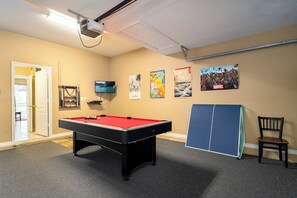 Game room showing pool table and ping pong