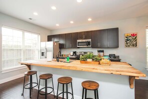 Fully Stocked Kitchen with Barstool seating