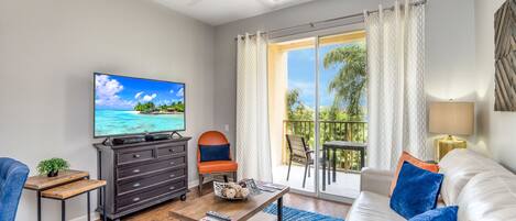 Living room with 55" TV and stunning views of lake Cay