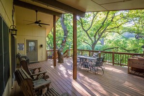 Cozy up in a comfortable Adirondack chair, under the covered porch