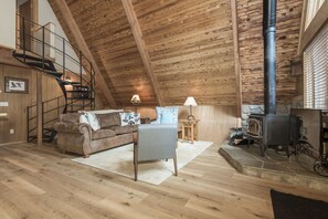 great room with soaring cedar ceilings, wood stove and New floors