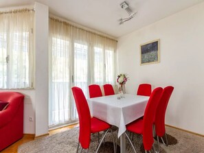 Sunny  dining area , balcony exit
