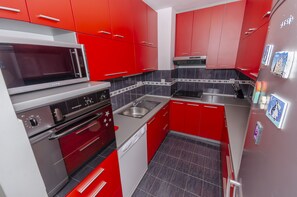 Kitchen - stovetop, oven, microwave, refrigerator, dishwasher
