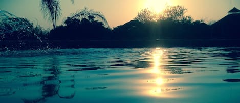 Swimming pool with the beautiful sundowner...