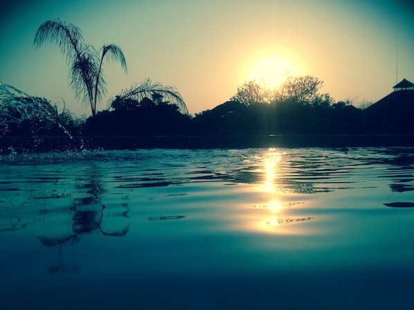 Swimming pool with the beautiful sundowner...