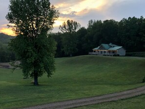 The lodge is located on the top of a hill overlooking the valley.