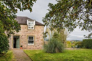 Crailing Coach House - the front door of the cottage and garden area