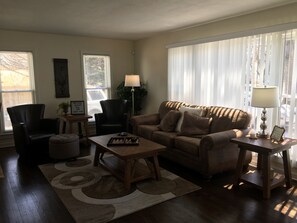Beautiful living room with new furniture, including a Simmons queen sleeper sofa