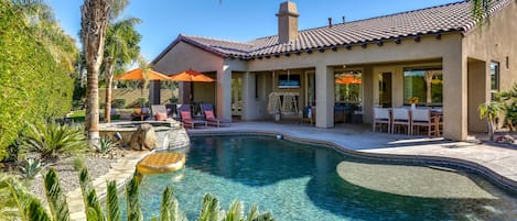 Private backyard with large pool and spa, fire pit, lounge seating, 2 fireplaces, 7-hole putting green, corn hole, ping pong, al fresco dining and more!