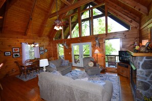 Living room with gas fireplace and TV