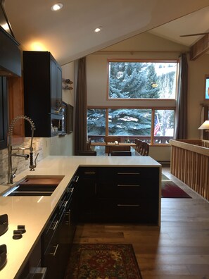Stunning new kitchen, opens to the dining room and lovely view.