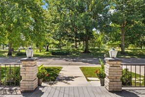 Welcoming front porch overlooks private community park 