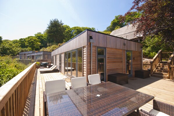 Outside decking and Rattan furniture, table and sun loungers