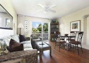 'Aloha' style living/dining room with glass sliding doors to lanai & pool/spa
