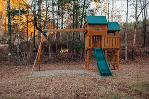 Kids can run, play, slide and swing on this private outdoor playground