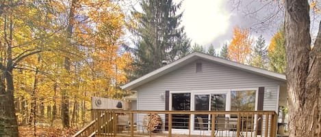 Cabin exterior with spacious deck overlooking the scenic Betsie River