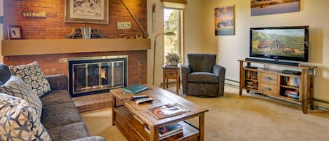 Living room with fireplace and TV