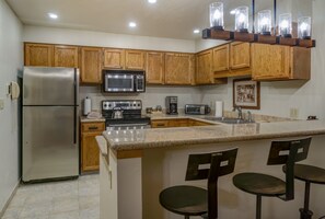 Full Kitchen with Bar and Stools at Steamboat Rental