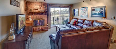 Living Room at this vacation condo in steamboat springs with long couch