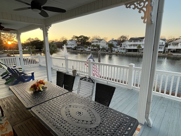 View from our porch of Sandlapper Lake and the fountains.  Tables seat 12